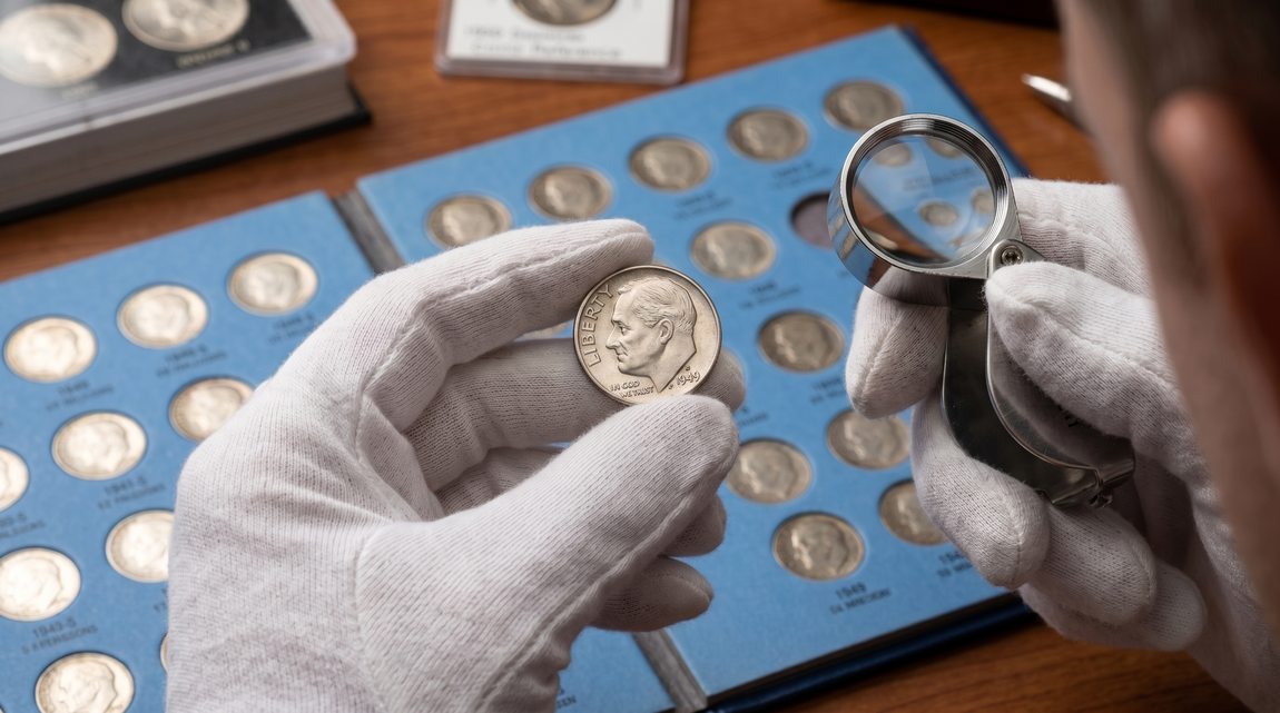 Coin appraiser examining the front of a 1949-S Silver Roosevelt Dime
