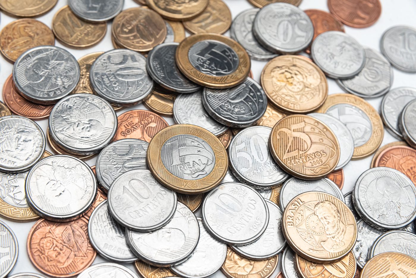 A close-up of a pile of world coins