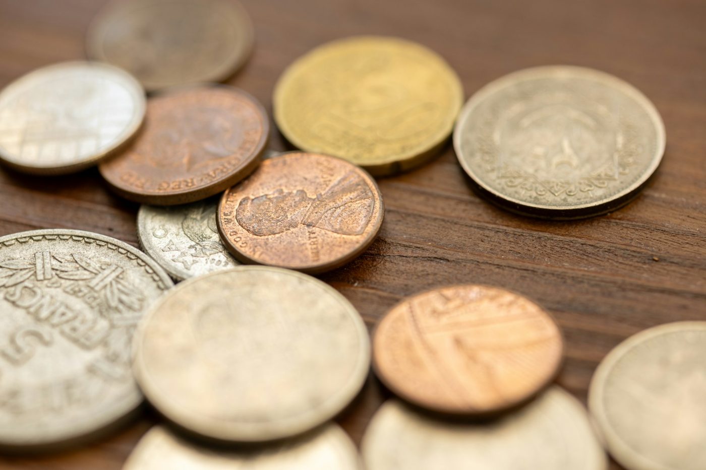 A close-up of scattered vintage coins