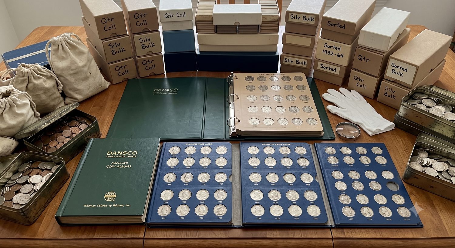 A large quarter collection in Dansco albums and labeled boxes, ready for evaluation